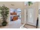 Bright foyer with neutral tones, decorative glass front door, and a view into a bedroom with bunk beds at 2655 Star Lake View Dr, Kissimmee, FL 34747