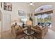 Cozy living room with comfortable sofas, sliding doors to lanai and pool area, and natural lighting at 2655 Star Lake View Dr, Kissimmee, FL 34747
