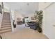 Spacious living room with stairway, neutral carpet, and view of dining area with seating for six at 2655 Star Lake View Dr, Kissimmee, FL 34747