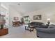 Open-concept living room and dining area with comfortable seating and a view of the landscaped backyard at 2655 Star Lake View Dr, Kissimmee, FL 34747