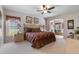 Spacious main bedroom with a ceiling fan, ensuite sitting area and natural light at 2655 Star Lake View Dr, Kissimmee, FL 34747