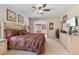 Comfortable main bedroom with a ceiling fan, seating area and natural light at 2655 Star Lake View Dr, Kissimmee, FL 34747