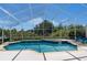 Relaxing screened-in pool and spa with views of lush greenery at 2655 Star Lake View Dr, Kissimmee, FL 34747