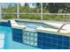 Close-up of luxurious pool with spa and decorative glass blocks at 2655 Star Lake View Dr, Kissimmee, FL 34747