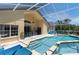 Expansive outdoor living with screened pool, patio, and lounge chairs at 2655 Star Lake View Dr, Kissimmee, FL 34747