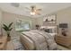 Beautifully decorated bedroom with a ceiling fan, and large window at 26807 Bull Run, Leesburg, FL 34748