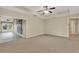 Spacious bedroom featuring neutral walls, carpet flooring, and a ceiling fan for added comfort at 26807 Bull Run, Leesburg, FL 34748