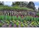 Arlington Ridge community entrance sign surrounded by colorful flowers and lush landscaping at 26807 Bull Run, Leesburg, FL 34748