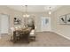 Elegant dining room with stylish lighting, neutral paint, and an inviting atmosphere for gatherings and meals at 26807 Bull Run, Leesburg, FL 34748