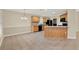Kitchen with wood cabinets, breakfast bar, and stainless steel appliances offers an open space to dine at 26807 Bull Run, Leesburg, FL 34748