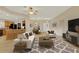 Open-concept living room seamlessly flows to the kitchen and dining area, ideal for entertaining and comfortable living at 26807 Bull Run, Leesburg, FL 34748