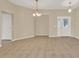 Spacious living room with tile flooring, neutral walls, and ample natural light, perfect for entertaining guests at 26807 Bull Run, Leesburg, FL 34748