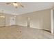 Expansive living room with tile flooring, neutral paint, and modern lighting for a comfortable living space at 26807 Bull Run, Leesburg, FL 34748