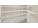 Walk-in pantry featuring multiple shelves for optimal organization and storage of items at 26807 Bull Run, Leesburg, FL 34748