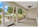 Relaxing screened-in porch with views of landscaped yard, providing a comfortable outdoor living space at 26807 Bull Run, Leesburg, FL 34748