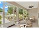 Relaxing screened porch with comfortable seating and serene views of the outdoors, providing a peaceful retreat at 26807 Bull Run, Leesburg, FL 34748