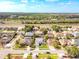 An aerial view shows the home in a neighborhood close to a major highway and several lakes at 2712 Rolling Broak Dr, Orlando, FL 32837