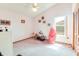 Bright bedroom with vaulted ceiling, a ceiling fan and carpeted floors at 2712 Rolling Broak Dr, Orlando, FL 32837