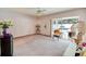 Cozy bedroom with sliding glass doors leading to the outdoor patio area at 2712 Rolling Broak Dr, Orlando, FL 32837
