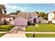Charming two-story home features a well-manicured lawn and attached two-car garage at 2712 Rolling Broak Dr, Orlando, FL 32837