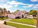 Beautifully landscaped front yard and 2 car garage make this two story home inviting at 2712 Rolling Broak Dr, Orlando, FL 32837