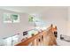 Bright interior view from the staircase, with dining and living areas visible below at 2712 Rolling Broak Dr, Orlando, FL 32837