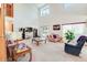 Spacious living room with two-story ceilings, comfortable furniture, and large windows at 2712 Rolling Broak Dr, Orlando, FL 32837