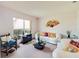 Cozy living room with comfortable seating, stylish decor, and bright natural light at 2712 Rolling Broak Dr, Orlando, FL 32837