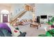 Spacious living room with high ceilings, grand staircase, and comfortable seating at 2712 Rolling Broak Dr, Orlando, FL 32837