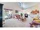 Bright living room with access to the patio and pool, perfect for indoor/outdoor living at 2712 Rolling Broak Dr, Orlando, FL 32837