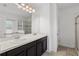 Bathroom features a double vanity sink and large mirror with access to the shower at 3345 Reedy Glen Dr, Kissimmee, FL 34758