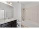 Bathroom features a vanity sink and a shower and tub combination at 3345 Reedy Glen Dr, Kissimmee, FL 34758