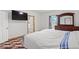 Bedroom with a dresser and bed near a window and access to a bathroom at 3345 Reedy Glen Dr, Kissimmee, FL 34758