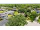 Aerial view of homes in a neighborhood with lots of trees and well-manicured lawns at 3468 Woodley Park Pl, Oviedo, FL 32765
