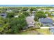 Aerial view of home featuring backyard with a screen enclosed pool and mature trees at 3468 Woodley Park Pl, Oviedo, FL 32765