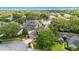 Aerial view of homes in a neighborhood with lots of trees and pools at 3468 Woodley Park Pl, Oviedo, FL 32765