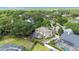 Aerial view of a two-story home with a screened-in pool in the backyard at 3468 Woodley Park Pl, Oviedo, FL 32765