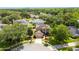 Aerial view of two-story home and beautifully landscaped yard in a suburban neighborhood at 3468 Woodley Park Pl, Oviedo, FL 32765