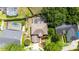 Overhead view of a home featuring a landscaped yard, pool, and surrounding greenery at 3468 Woodley Park Pl, Oviedo, FL 32765