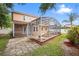 Spacious backyard featuring a screened-in pool and patio at 3468 Woodley Park Pl, Oviedo, FL 32765