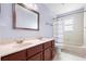 Bathroom with a double sink vanity and a shower/tub combo at 3468 Woodley Park Pl, Oviedo, FL 32765