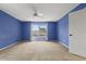 This bedroom features plush carpet and a window with a nice view at 3468 Woodley Park Pl, Oviedo, FL 32765