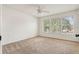 This bedroom has a ceiling fan and three windows for natural light at 3468 Woodley Park Pl, Oviedo, FL 32765