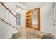 Welcoming foyer with tile flooring, staircase, and a secret entrance to a room at 3468 Woodley Park Pl, Oviedo, FL 32765