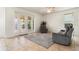 Bright living room featuring sliding glass doors, comfortable seating, and a cozy rug, perfect for relaxation at 3468 Woodley Park Pl, Oviedo, FL 32765
