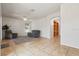 Spacious living room with neutral decor, comfortable seating, and tile floors, promoting a relaxed atmosphere at 3468 Woodley Park Pl, Oviedo, FL 32765