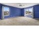 Spacious main bedroom with large windows providing natural light and a serene, inviting atmosphere at 3468 Woodley Park Pl, Oviedo, FL 32765