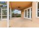 Covered patio with a ceiling fan and access to the backyard at 3468 Woodley Park Pl, Oviedo, FL 32765
