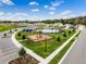Aerial shot of the community park area, pool, playground, pavilion, and surrounding homes at 3617 Fort Mellon Ln, Sanford, FL 32773
