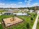 Aerial view featuring the community playground, pool, pavilion, and manicured landscapes at 3617 Fort Mellon Ln, Sanford, FL 32773